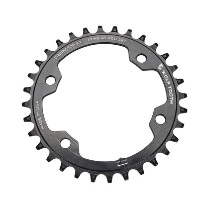 Einfach-Kettenblatt WOLF TOOTH 96 BCD 12-fach Shimano, 4-Loch, 96 mm, Schwarz — Kettenblatt auf weißem Hintergrund