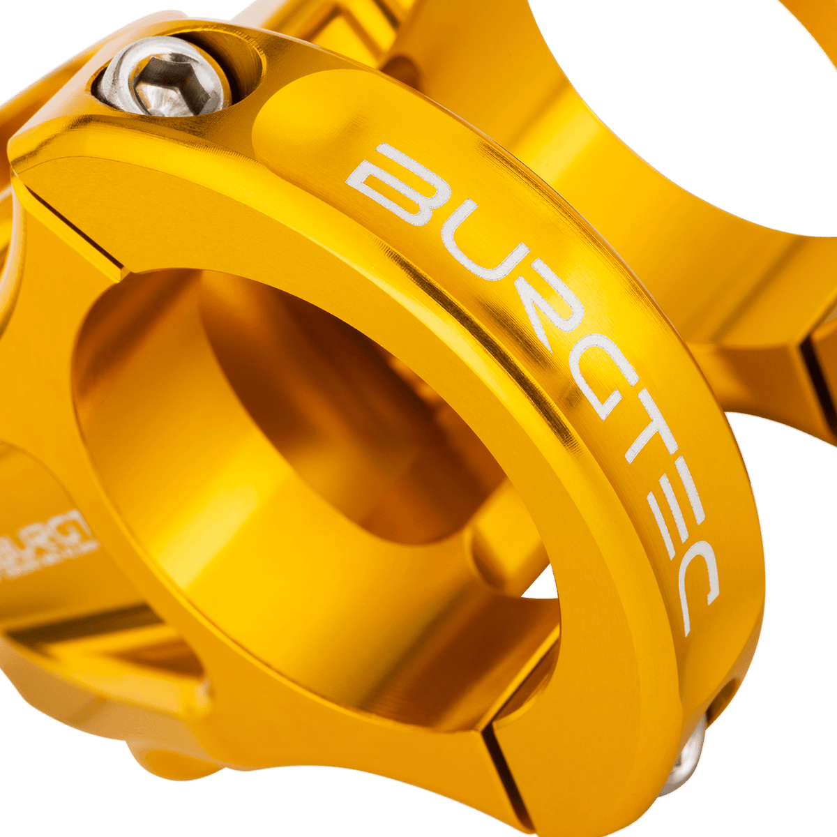 BURGTEC ENDURO MK3 Vorbau in Gold — Detail der Lenkerklemmung